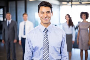 successful-business-man-smiling-while-her-colleagues-standing-him-office_107420-8503.jpg